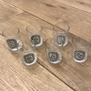 Six empty Diptyque candles
